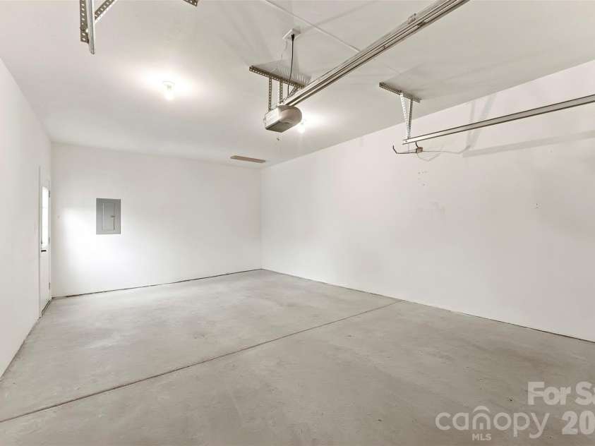 14100 Garden District Row, Huntersville, NC 28078.  MLS# CAR4420231, YatesRealty ID 49800. Attached one-car garage