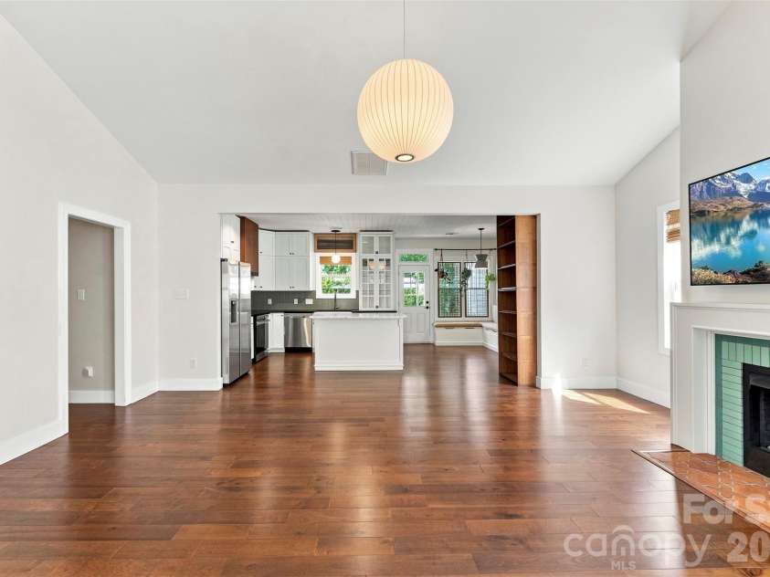 14100 Garden District Row, Huntersville, NC 28078.  MLS# CAR4420231, YatesRealty ID 49800. Open living area with vaulted ceiling
