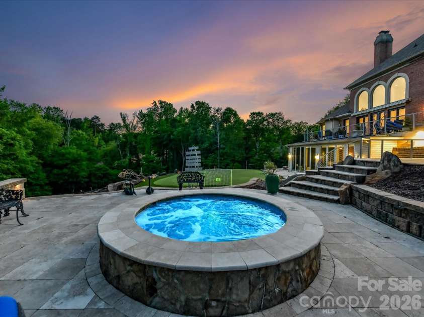 2723 Providence Pine Lane, Charlotte, NC 28270.  MLS# CAR4419389, YatesRealty ID 49807. Twilight view from the oversized spa.