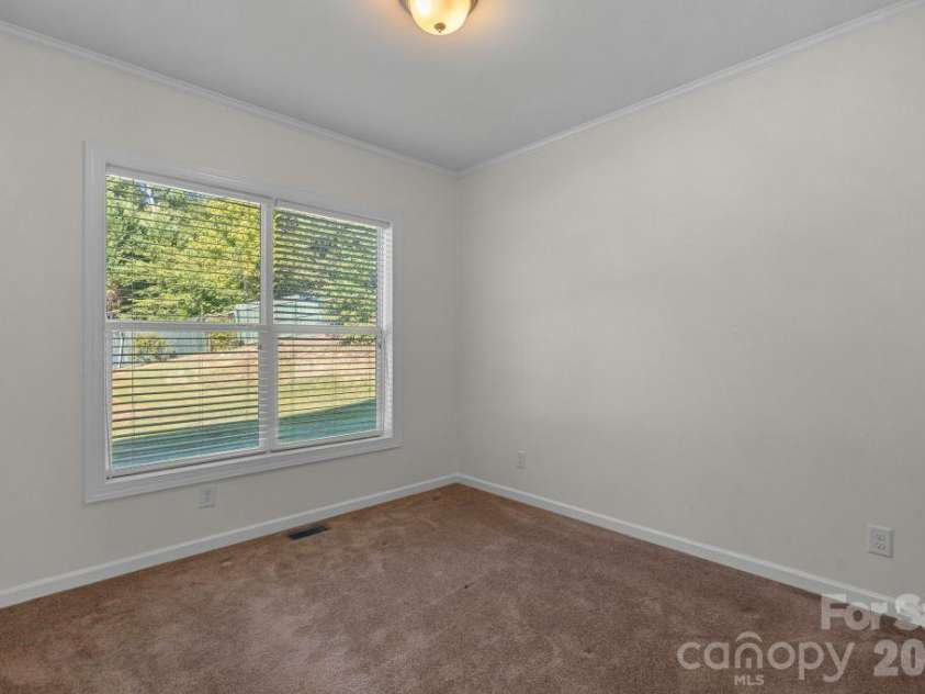 10429 Starwood Drive, Charlotte, NC 28215.  MLS# CAR4412020, YatesRealty ID 49827. 2nd guest bedroom on main level. Virtually staged