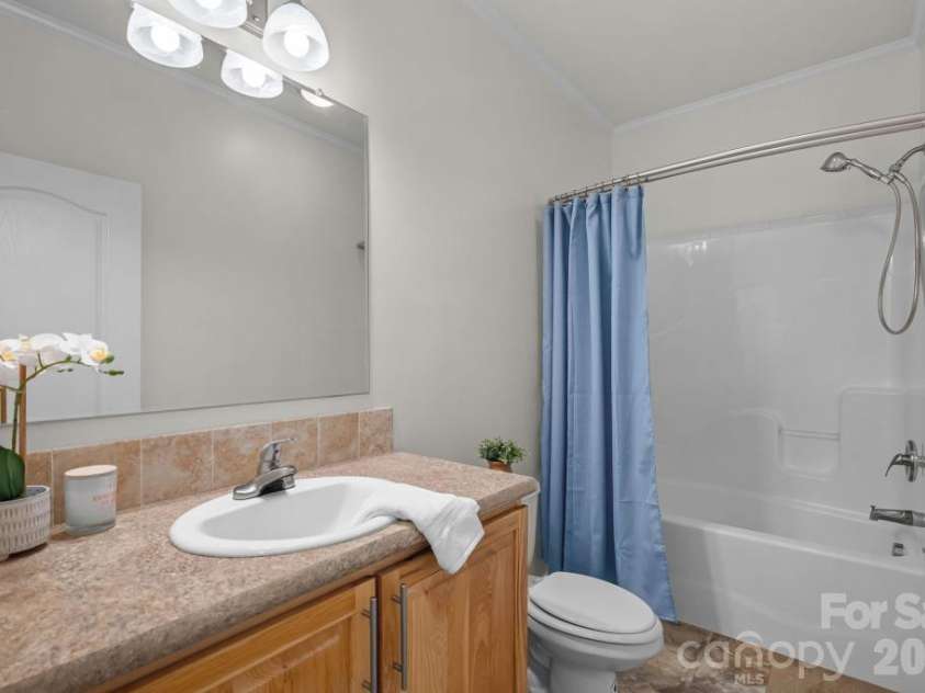 10429 Starwood Drive, Charlotte, NC 28215.  MLS# CAR4412020, YatesRealty ID 49827. Full Guest bathroom on main level