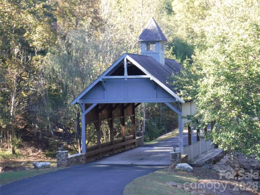 1237 South Cove Road, Mill Spring, NC 28756.  MLS# CAR4421708, YatesRealty ID 49838. Lake Adger- Covered Bridge