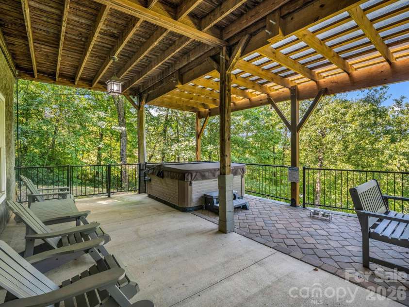 1237 South Cove Road, Mill Spring, NC 28756.  MLS# CAR4421708, YatesRealty ID 49838. Lower-Level Outdoor Space with Hot Tub