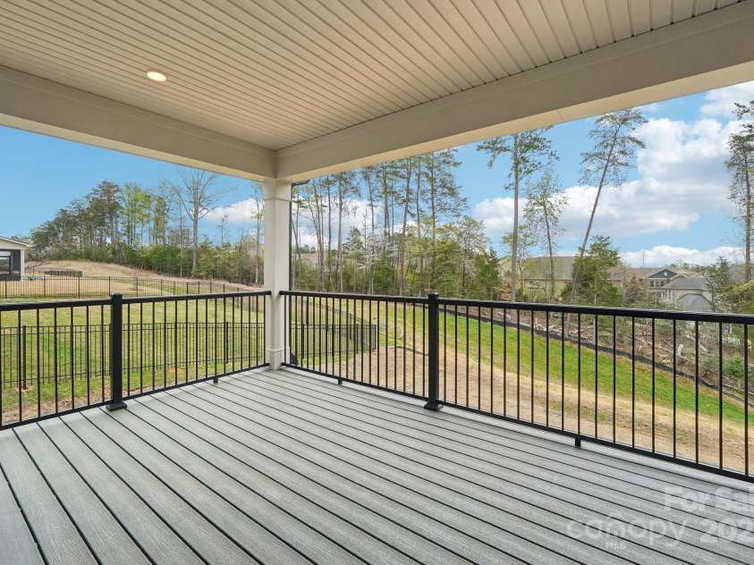 163 Windy Dell Drive, Tega Cay, SC 29708.  MLS# CAR4239219, YatesRealty ID 4984. Deck off Dining Area