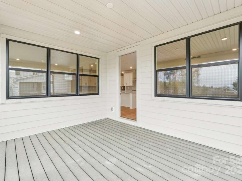 163 Windy Dell Drive, Tega Cay, SC 29708.  MLS# CAR4239219, YatesRealty ID 4984. Deck off Dining Area