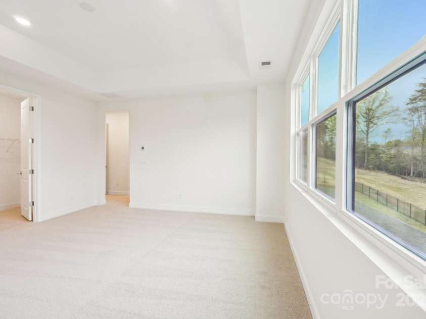 163 Windy Dell Drive, Tega Cay, SC 29708.  MLS# CAR4239219, YatesRealty ID 4984. Primary Bedroom