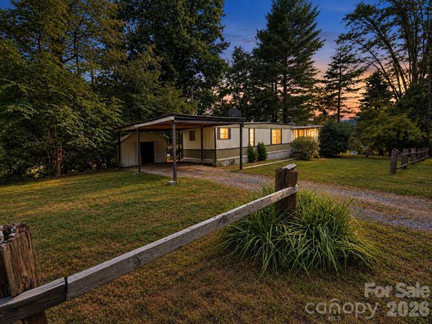 1491 Prices Creek Road, Burnsville, NC 28714.  MLS# CAR4422423, YatesRealty ID 49844. Front Twilight
