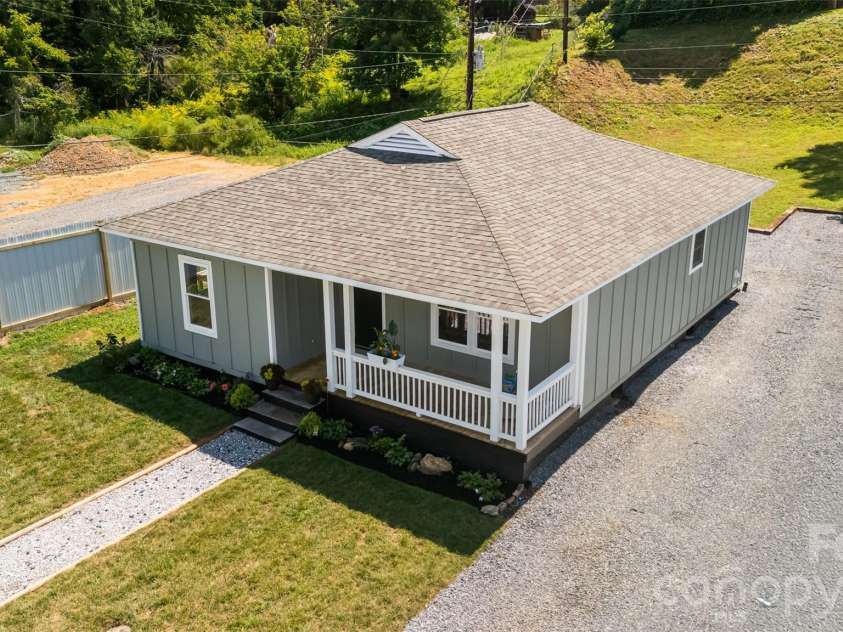 156 Edwards Avenue, Swannanoa, NC 28778.  MLS# CAR4422334, YatesRealty ID 49847. Aerial view with front and back yard