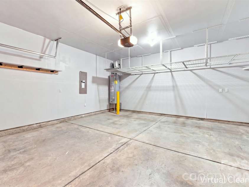 8219 Paw Valley Lane, Charlotte, NC 28214.  MLS# CAR4421685, YatesRealty ID 49848. 2 car garage with shelving