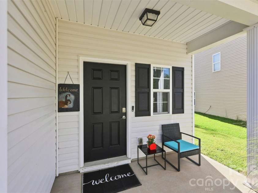 8219 Paw Valley Lane, Charlotte, NC 28214.  MLS# CAR4421685, YatesRealty ID 49848. Covered front porch