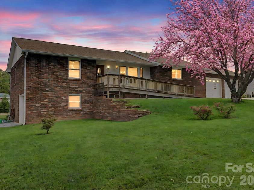 230 Blythewood Drive, Hendersonville, NC 28792.  MLS# CAR4422676, YatesRealty ID 49849. Cherry Tree in Full Bloom in Spring