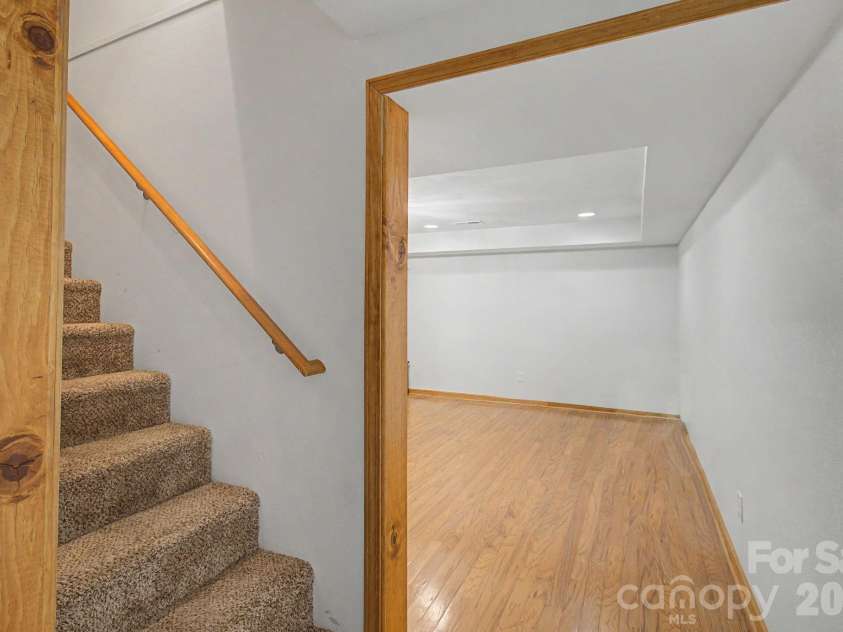 230 Blythewood Drive, Hendersonville, NC 28792.  MLS# CAR4422676, YatesRealty ID 49849. Explore the Possibilites Downstairs