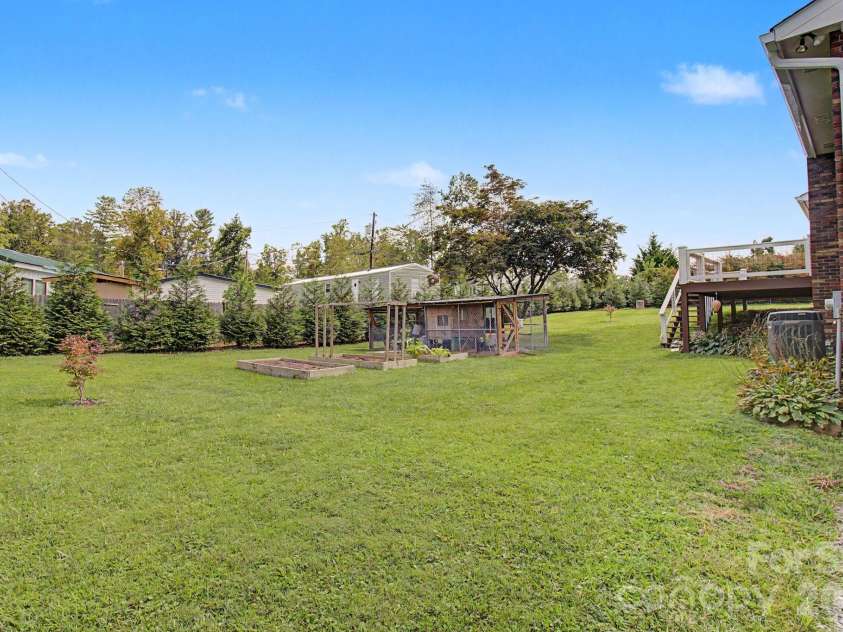 230 Blythewood Drive, Hendersonville, NC 28792.  MLS# CAR4422676, YatesRealty ID 49849. Flat and Usable Yard