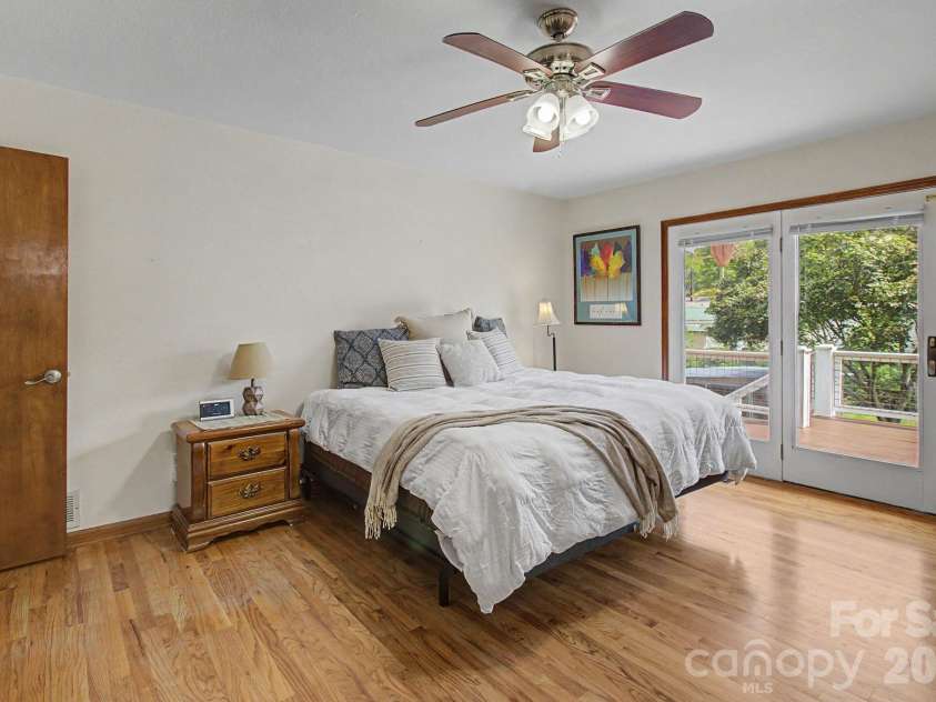 230 Blythewood Drive, Hendersonville, NC 28792.  MLS# CAR4422676, YatesRealty ID 49849. Primary Bedroom with Deck Access