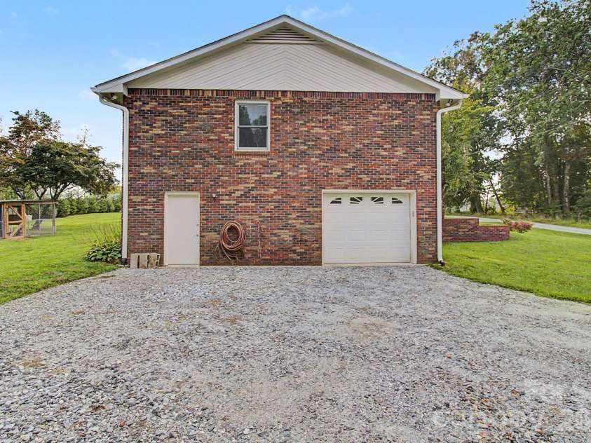 230 Blythewood Drive, Hendersonville, NC 28792.  MLS# CAR4422676, YatesRealty ID 49849. Side Garage with Door Entry