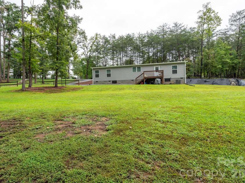 346 Tricycle Hill Lane, Tryon, NC 28782.  MLS# CAR4419540, YatesRealty ID 49859. 1¼+ acres offering space, privacy, and peace