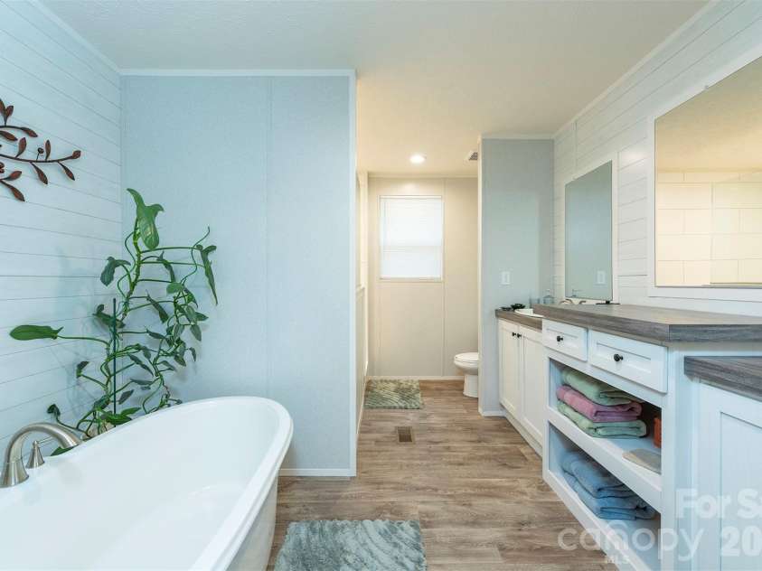 346 Tricycle Hill Lane, Tryon, NC 28782.  MLS# CAR4419540, YatesRealty ID 49859. The primary bathroom