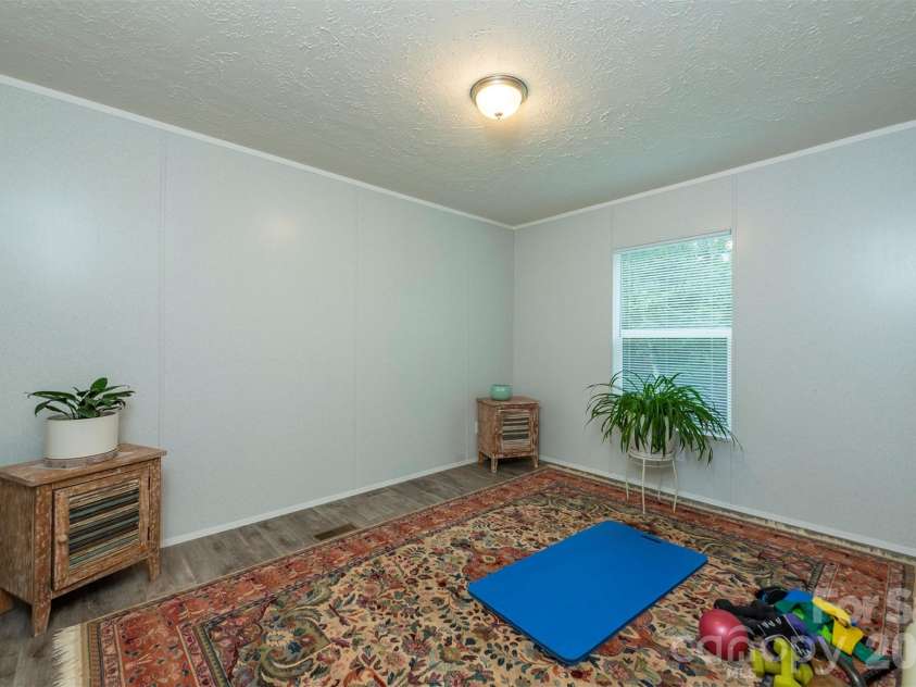 346 Tricycle Hill Lane, Tryon, NC 28782.  MLS# CAR4419540, YatesRealty ID 49859. Versatile third bedroom, currently used as a workout space