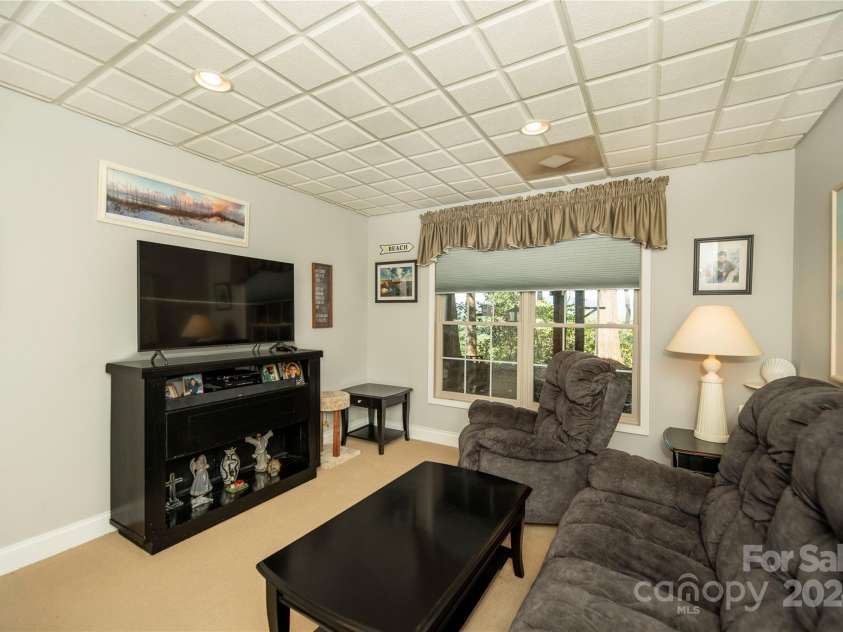 1244 Windover Drive, Brevard, NC 28712.  MLS# CAR4169991, YatesRealty ID 4987. Living Room in Basement