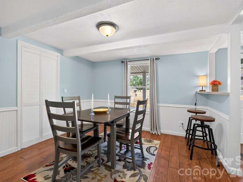 23 Maxwell Road, Asheville, NC 28805.  MLS# CAR4421518, YatesRealty ID 49871. Dining area with beadboard wainscoting