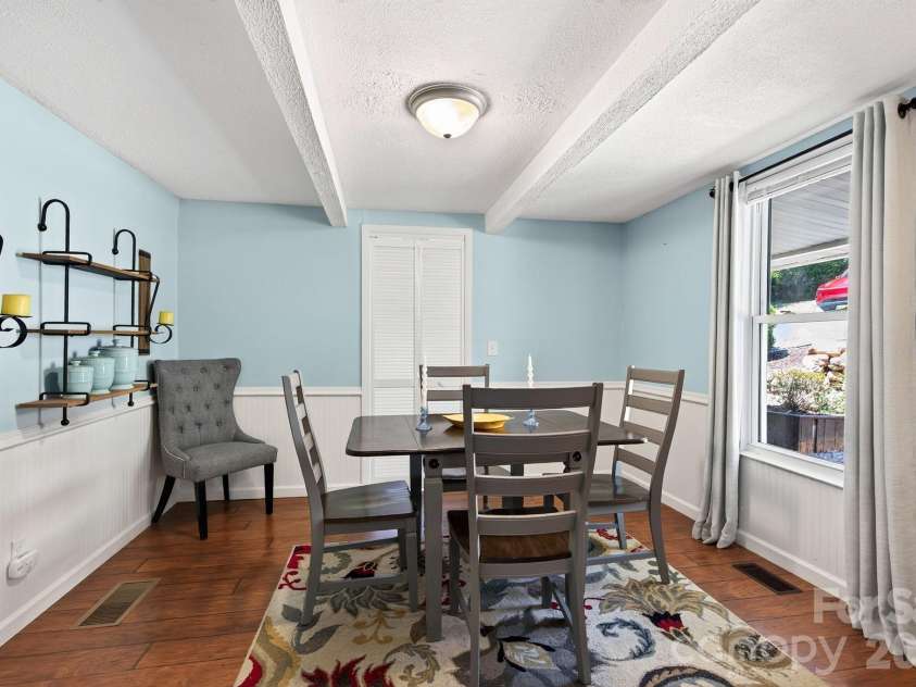 23 Maxwell Road, Asheville, NC 28805.  MLS# CAR4421518, YatesRealty ID 49871. Dining with Display Shelves