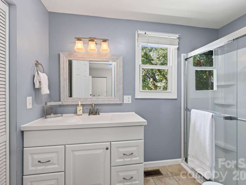 23 Maxwell Road, Asheville, NC 28805.  MLS# CAR4421518, YatesRealty ID 49871. Primary Bathroom with Additional Storage
