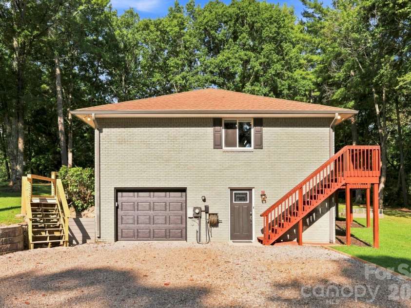 168 Country Lane, Mills River, NC 28759.  MLS# CAR4422309, YatesRealty ID 49874. Convenient lower-level garage plus multiple exterior access points and stairs to the main level.