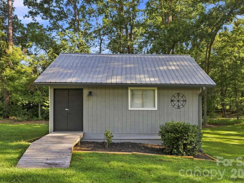 168 Country Lane, Mills River, NC 28759.  MLS# CAR4422309, YatesRealty ID 49874. Detached outbuilding with electricity adds valuable utility and flexibility beyond the main residence.