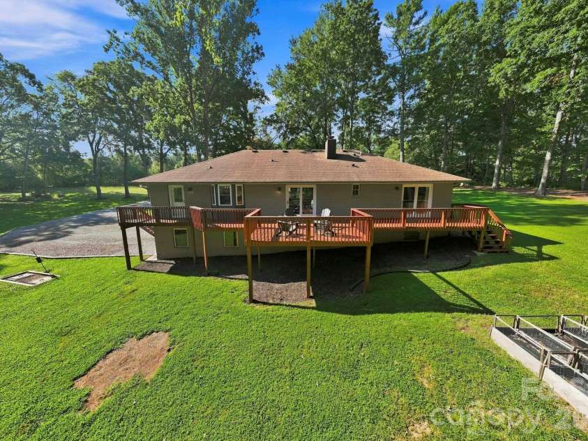 168 Country Lane, Mills River, NC 28759.  MLS# CAR4422309, YatesRealty ID 49874. Large multi-section deck offers exceptional outdoor living space overlooking the backyard.