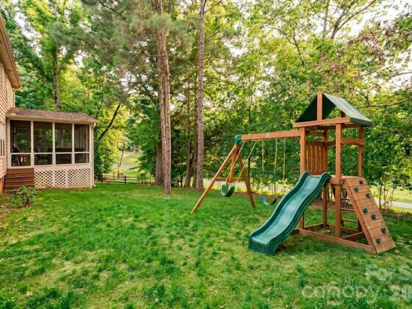 10009 Thomas Payne Circle, Charlotte, NC 28277.  MLS# CAR4421485, YatesRealty ID 49899. AI enhanced backyard