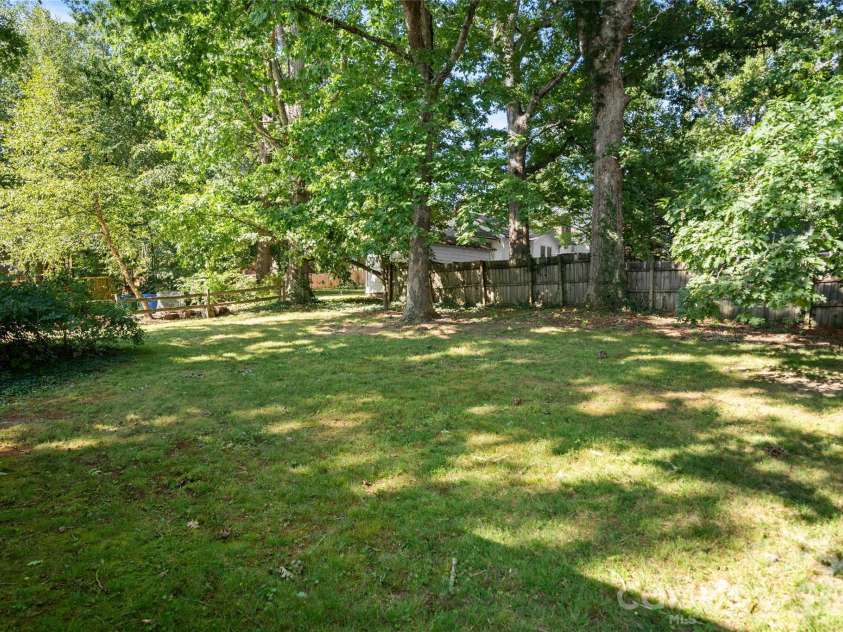 13 Browndale Road, Asheville, NC 28805.  MLS# CAR4382752, YatesRealty ID 49900. Level yard with majestic oaks