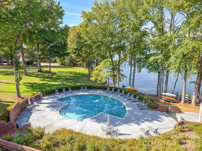 327 Northwest Drive, Davidson, NC 28036.  MLS# CAR4423032, YatesRealty ID 49906. Community pool and this is view from your balcony