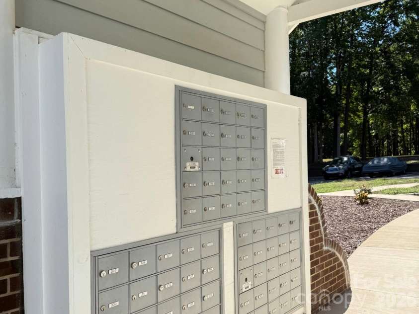 327 Northwest Drive, Davidson, NC 28036.  MLS# CAR4423032, YatesRealty ID 49906. Mailbox tree right beside your building