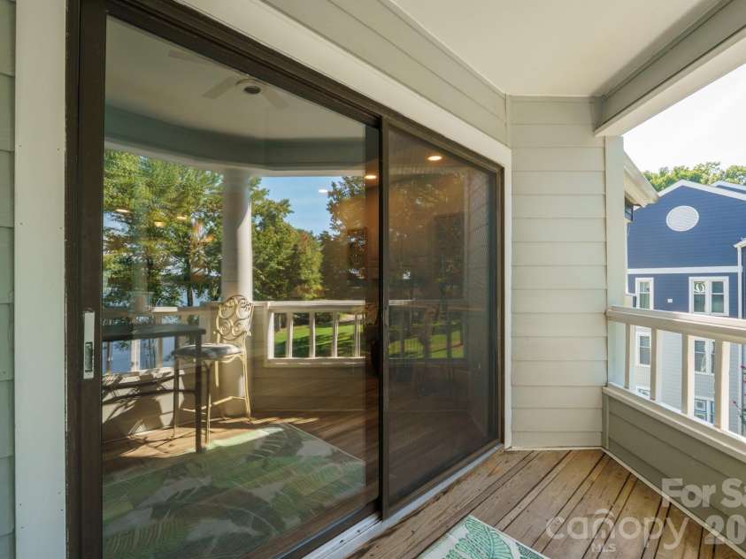 327 Northwest Drive, Davidson, NC 28036.  MLS# CAR4423032, YatesRealty ID 49906. Private balcony toward sliding doors