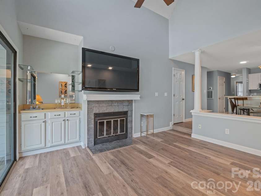 327 Northwest Drive, Davidson, NC 28036.  MLS# CAR4423032, YatesRealty ID 49906. Wet bar shown here with shelving and your fireplace