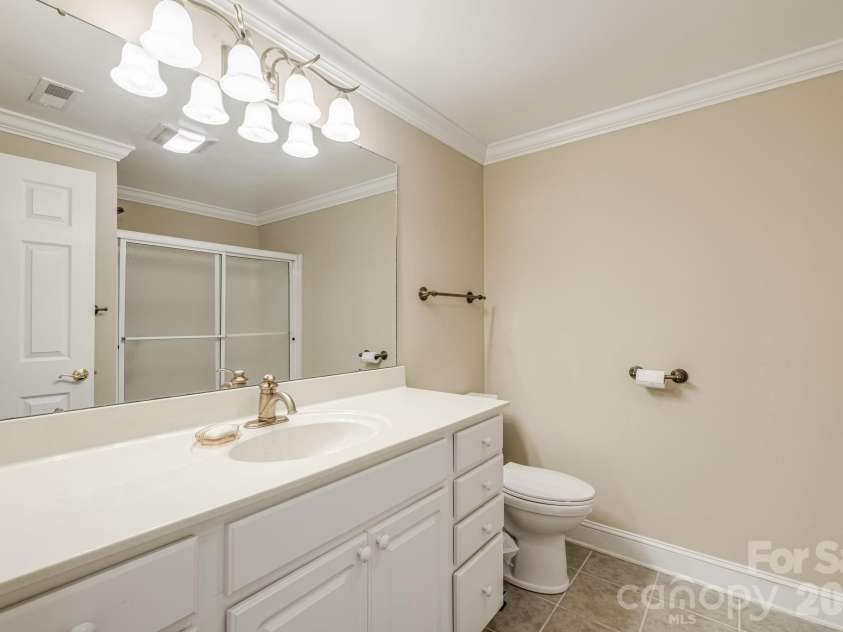 212 Carriage Springs Way, Hendersonville, NC 28791.  MLS# CAR4420645, YatesRealty ID 49923. Lower level guest bath.