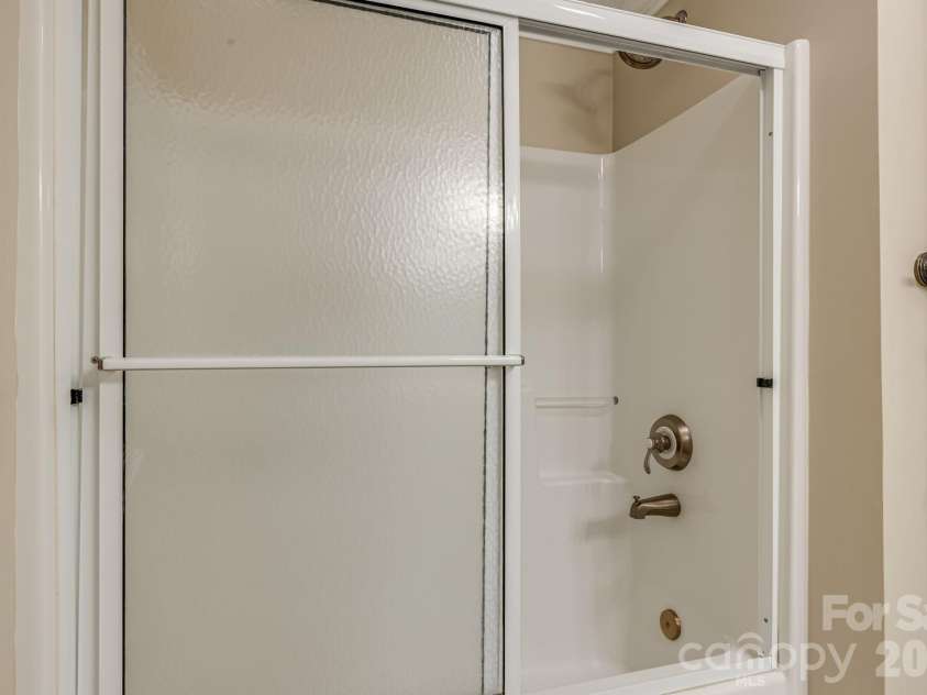 212 Carriage Springs Way, Hendersonville, NC 28791.  MLS# CAR4420645, YatesRealty ID 49923. Lower level guest bath