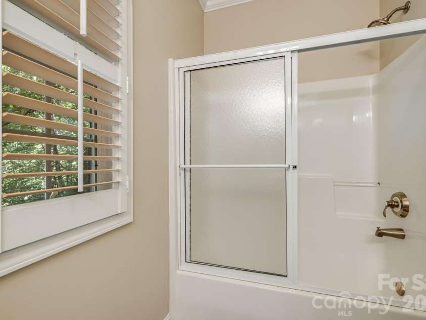 212 Carriage Springs Way, Hendersonville, NC 28791.  MLS# CAR4420645, YatesRealty ID 49923. Main level guest bath shower.