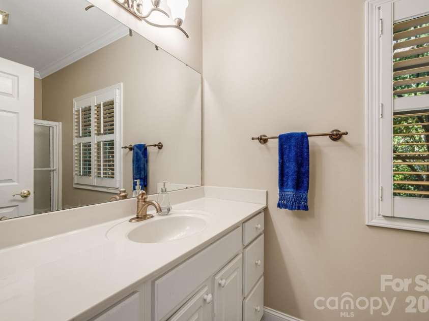 212 Carriage Springs Way, Hendersonville, NC 28791.  MLS# CAR4420645, YatesRealty ID 49923. Main level guest bath vanity.