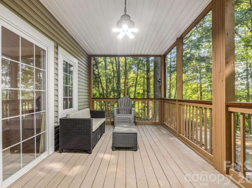 212 Carriage Springs Way, Hendersonville, NC 28791.  MLS# CAR4420645, YatesRealty ID 49923. Screened deck on lower level.