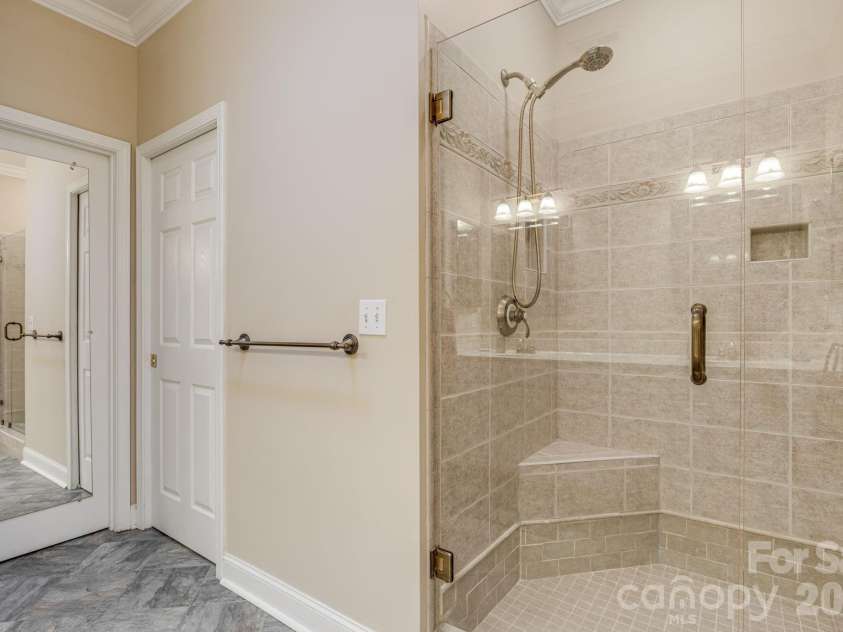 212 Carriage Springs Way, Hendersonville, NC 28791.  MLS# CAR4420645, YatesRealty ID 49923. Walk in shower.