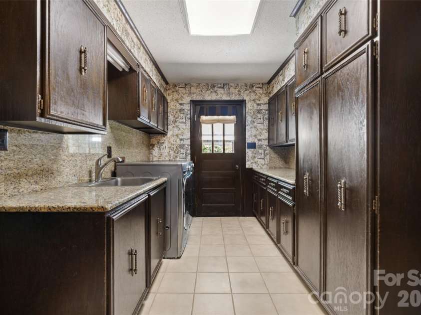 600 Fairway Drive, Fort Mill, SC 29715.  MLS# CAR4407842, YatesRealty ID 49927. Laundry room and back door