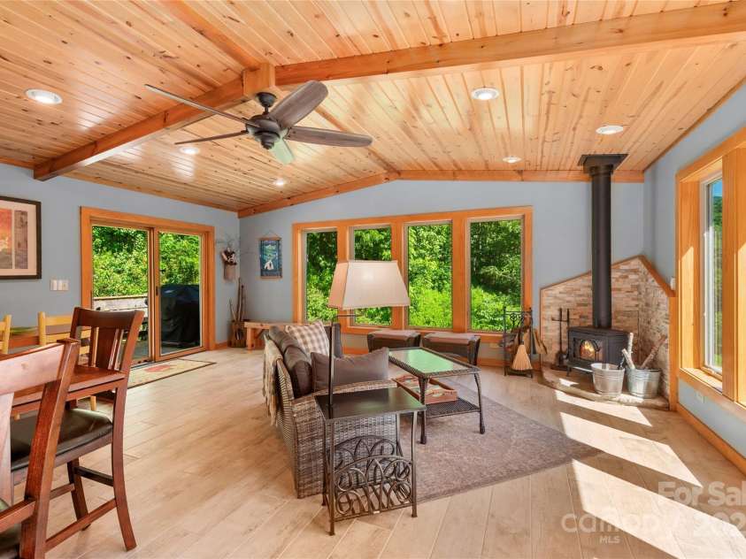 2316 NC 63 Highway, Hot Springs, NC 28743.  MLS# CAR4278288, YatesRealty ID 4993. Cozy wood stove in welcoming gathering room