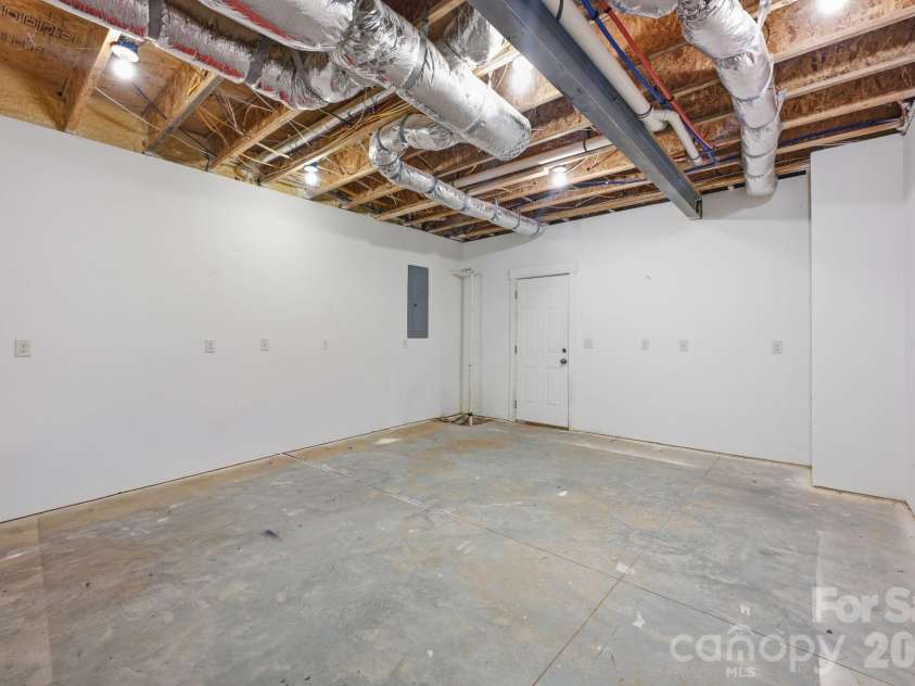 415 Goodrum Street, Davidson, NC 28036.  MLS# CAR4423264, YatesRealty ID 49977. Basement workshop and storage area