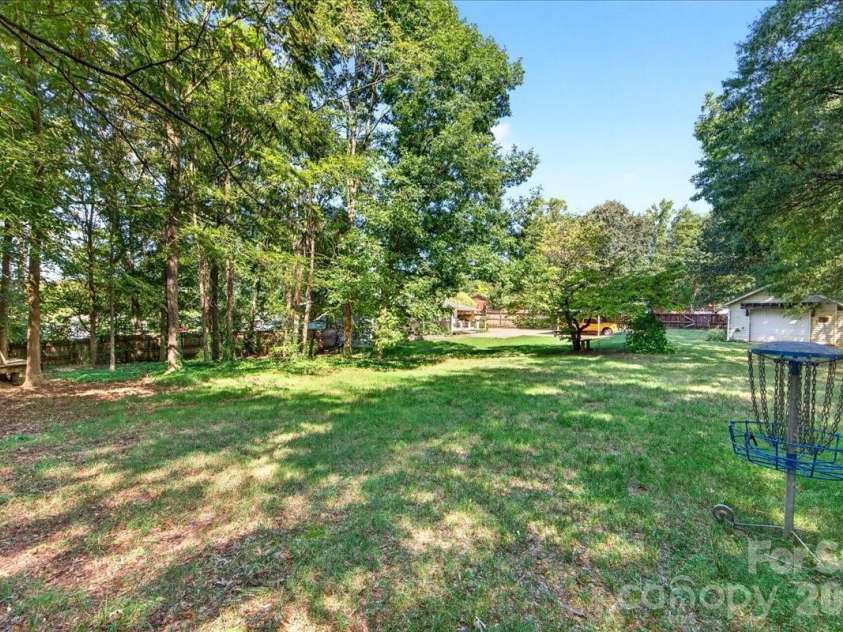1442 Plumcrest Drive, Charlotte, NC 28216.  MLS# CAR4422358, YatesRealty ID 49987. Backyard