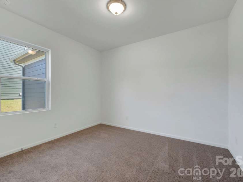 230 Amber Glen Drive, Locust, NC 28097.  MLS# CAR4423302, YatesRealty ID 49988. First floor bedroom