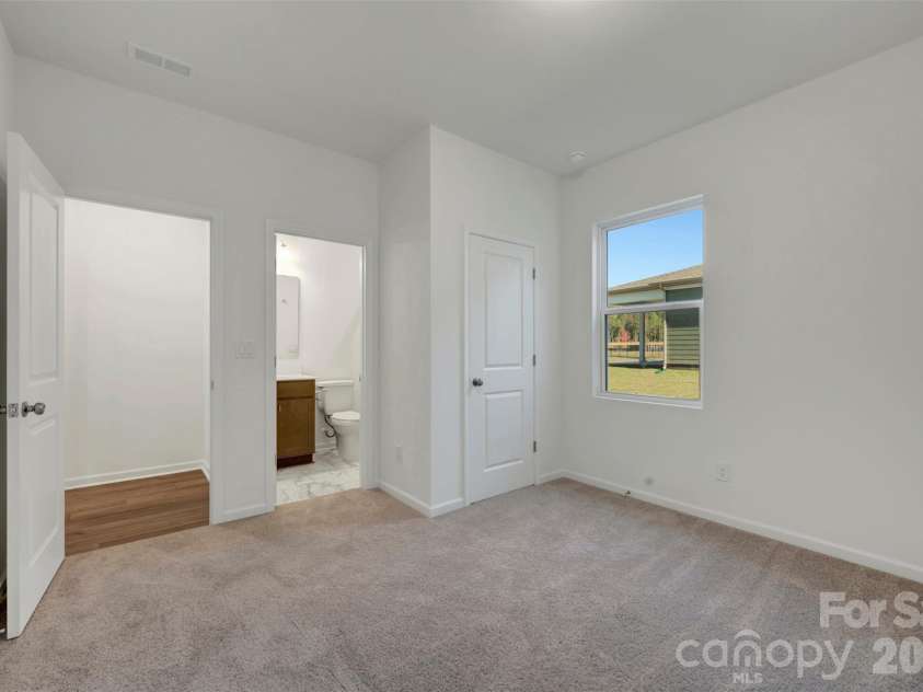 230 Amber Glen Drive, Locust, NC 28097.  MLS# CAR4423302, YatesRealty ID 49988. First floor bedroom