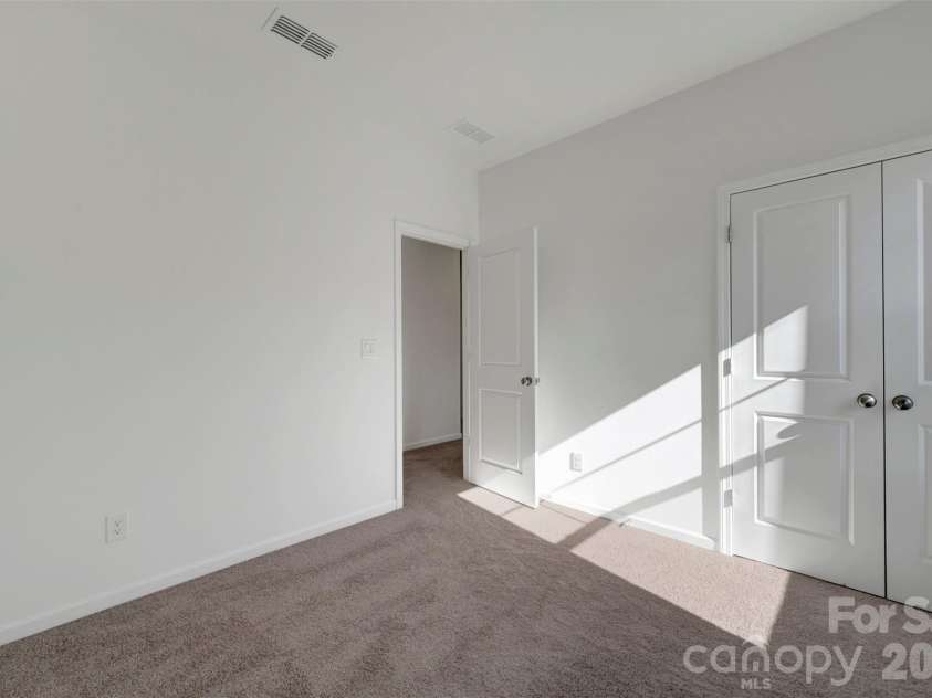 230 Amber Glen Drive, Locust, NC 28097.  MLS# CAR4423302, YatesRealty ID 49988. Secondary bedroom