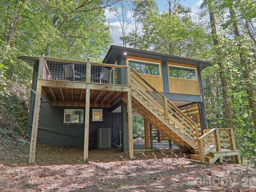 315 Bear Cove Road, Bryson City, NC 28713.  MLS# CAR4423012, YatesRealty ID 49999. Back deck and steps to firepit or carport