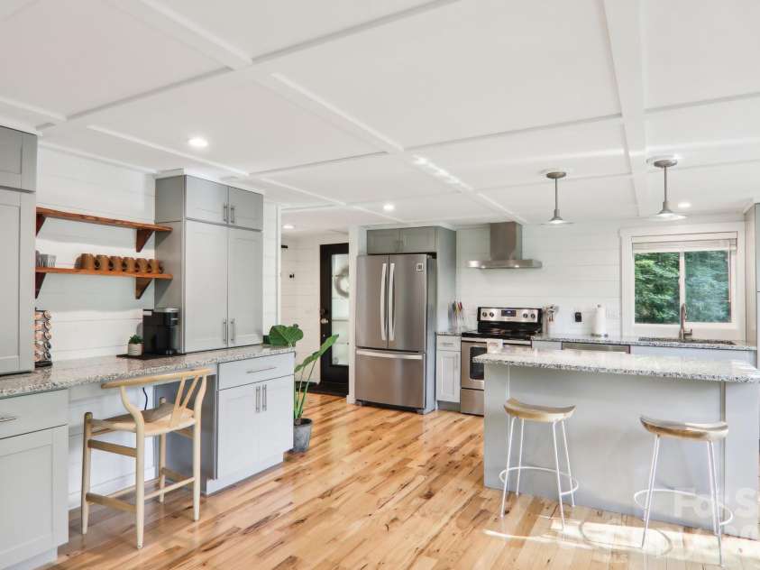 315 Bear Cove Road, Bryson City, NC 28713.  MLS# CAR4423012, YatesRealty ID 49999. Kitchen and workspace, coffee bar and extra storage